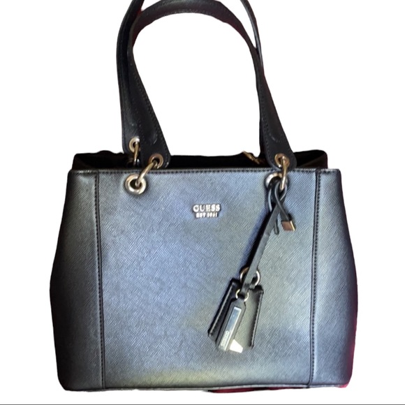 GUESS - Brand new Guess tote handbag in black. Multiple sections with pockets. - Picture 1 of 9